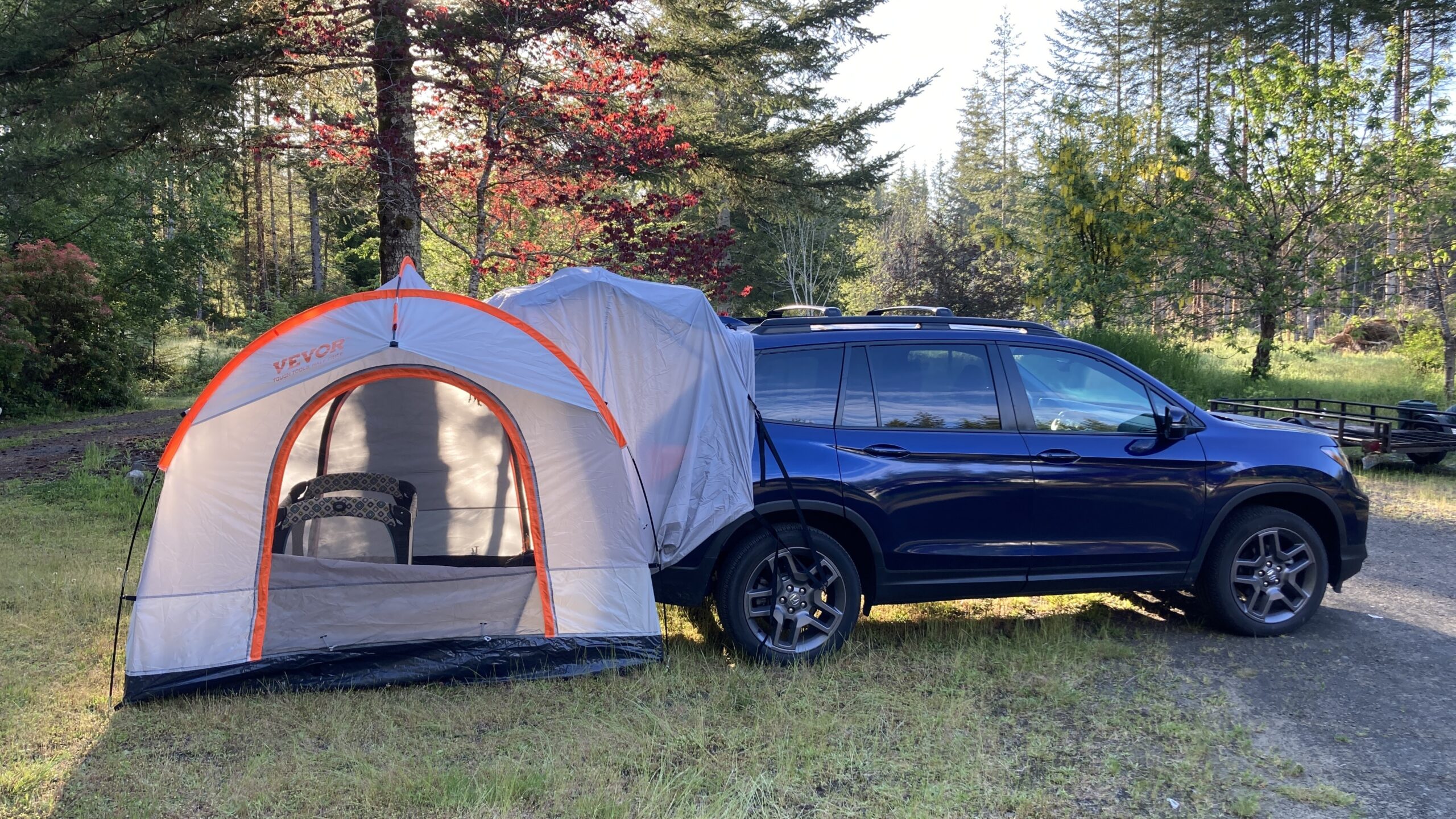 The Vevor tent pitched on the Honda Passport, seen in side profile
